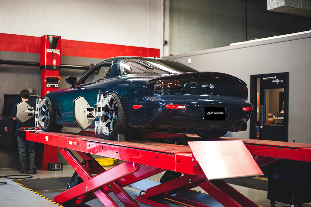 A car on the in-ground Hunter digital alignment rack