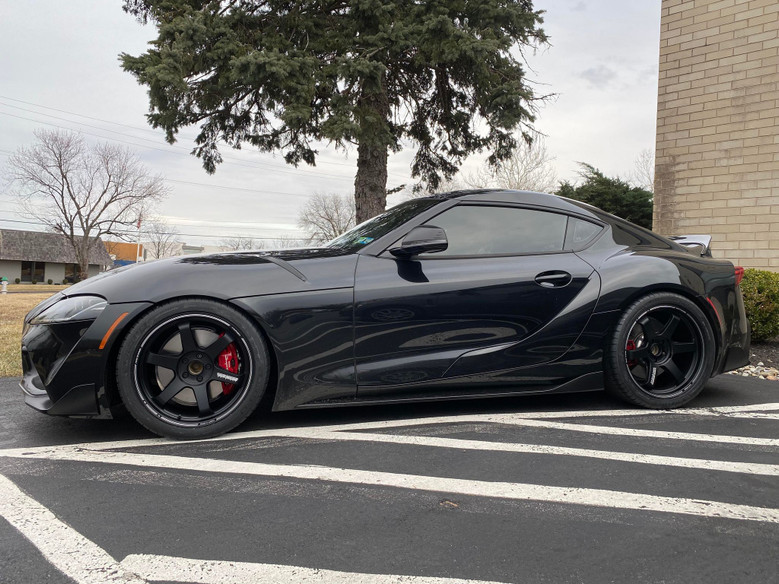 Black MKV Supra with Volk Racing TE37 Ultra Track Edition II wheels parked outdoors.